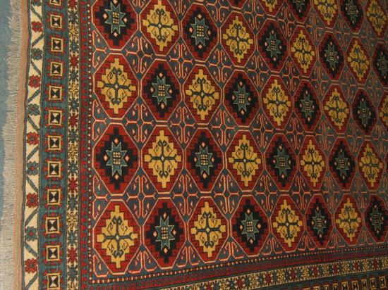 Appraisal: An Afghan Kazak woollen rug cm x cm