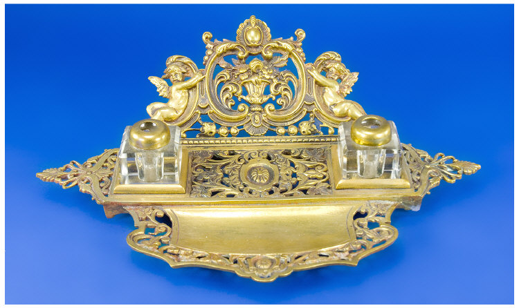 Appraisal: A Late th century cast brass double inkstand surmounted by