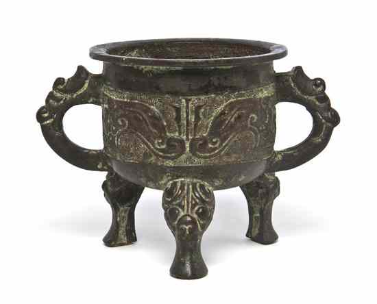 Appraisal: A Chinese Archaistic Style Bronze Censer of circular form flanked