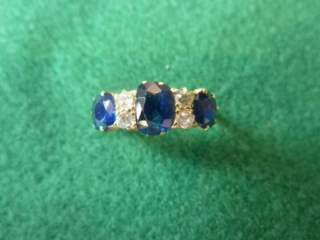 Appraisal: A sapphire and diamond-set ring the three graduated cushion-cut sapphire