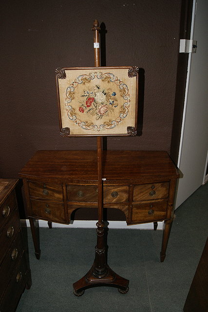 Appraisal: A VICTORIAN ROSEWOOD FRAMED POLE SCREEN with Berlin woolwork panel