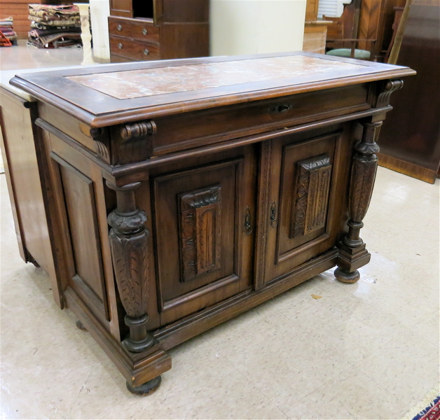 Appraisal: CARVED WALNUT SIDE CABINET German th century having a rectangular