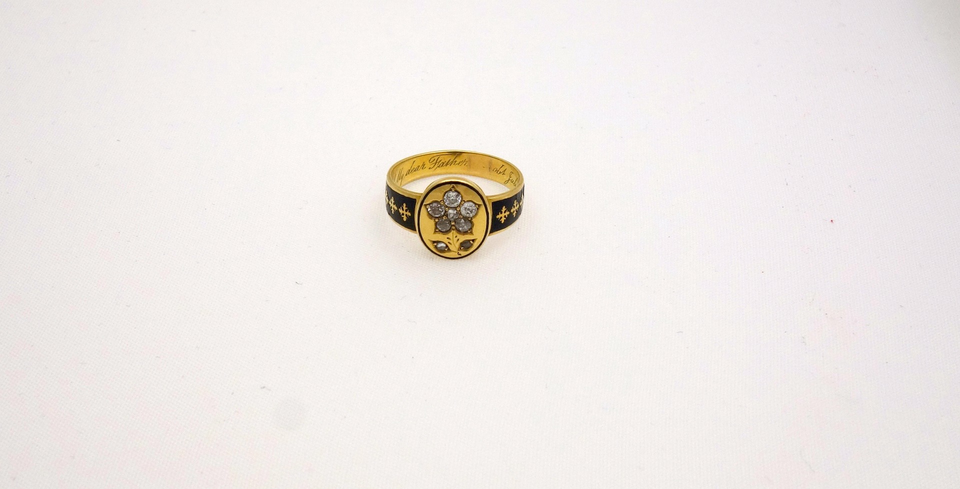 Appraisal: A Victorian gold enamel and diamond memorial ring the oval