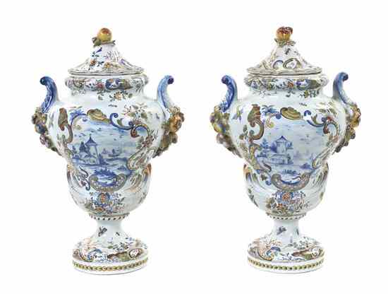 Appraisal: A Pair of Delft Pottery Covered Urns each having fruit