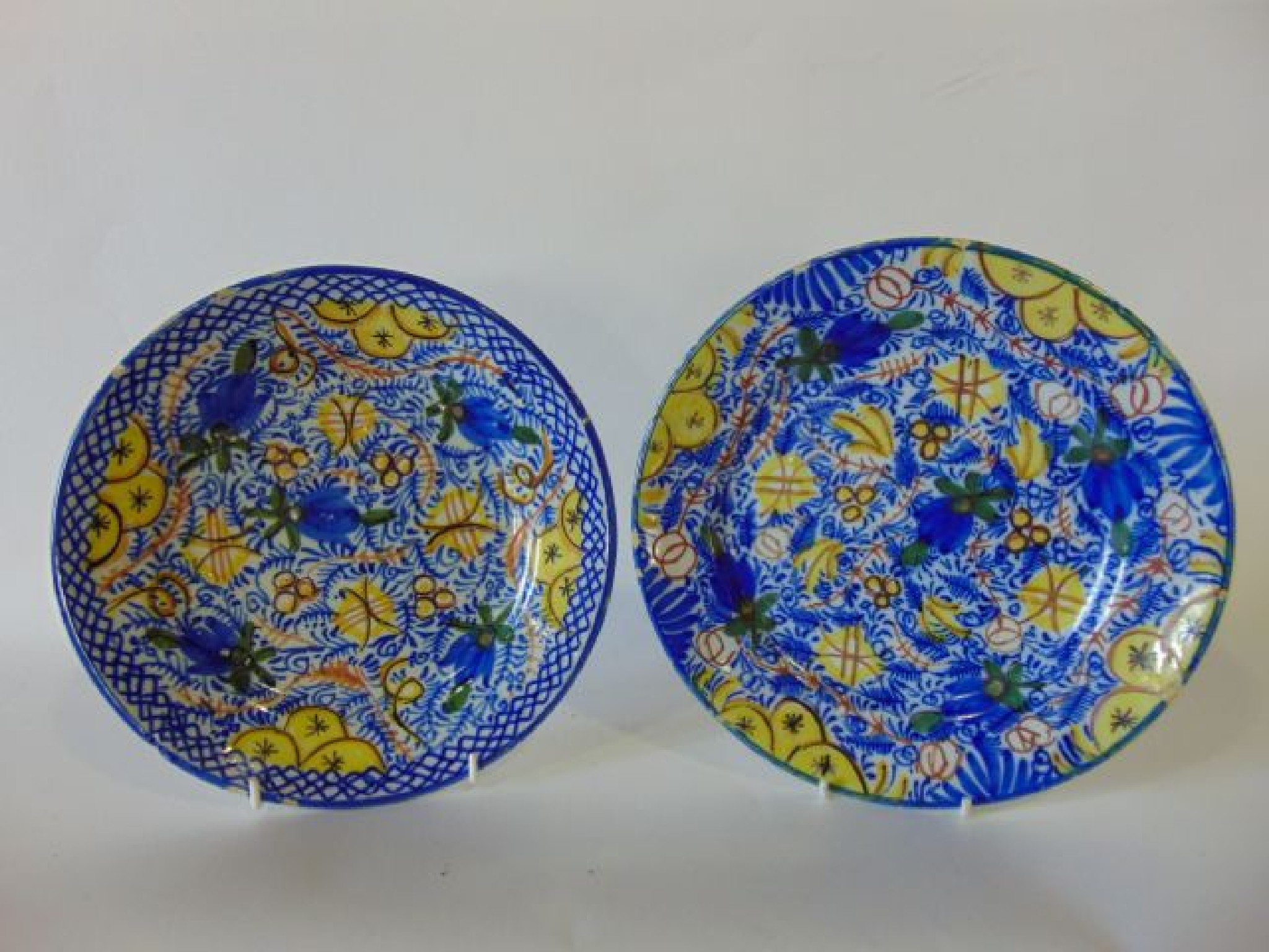 Appraisal: A pair of th century continental tin glazed earthenware plates