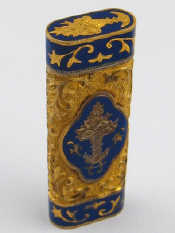 Appraisal: A cigarette lighter with enamelled yellow metal case the lighter