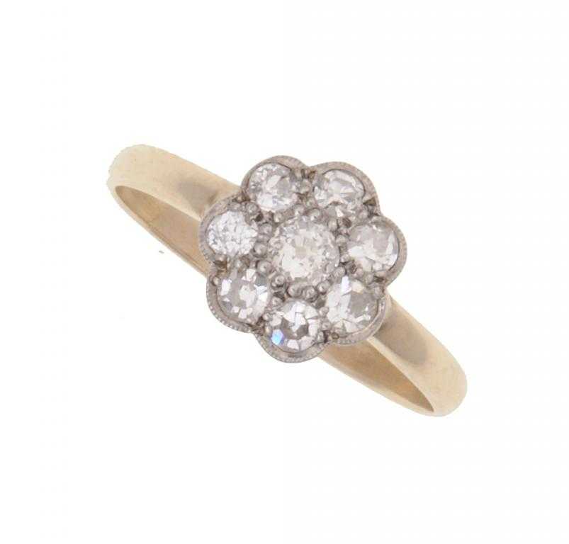 Appraisal: A DIAMOND SEVEN-STONE CLUSTER RING gold hoop