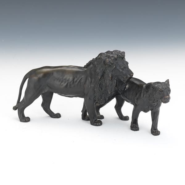 Appraisal: BRONZE LION AND LIONESS SCULPTURE x x Lion following a