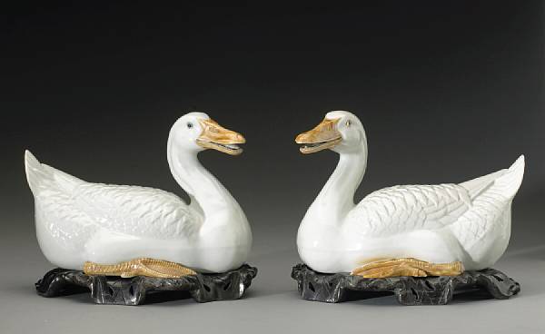 Appraisal: A pair of glazed porcelain ducks with iron wash decoration