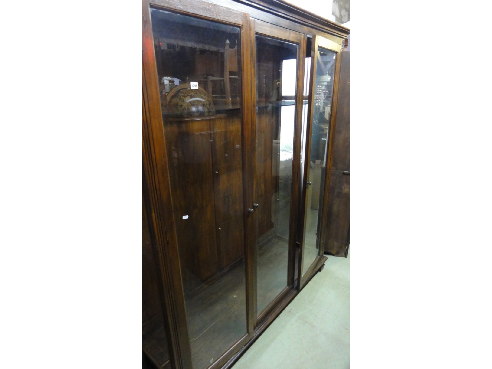 Appraisal: A substantial freestanding side display cabinet the hardwood frame with