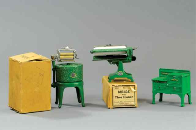 Appraisal: ASSORTED CAST IRON MINIATURE APPLIANCES Includes boxed Thor Ironer and