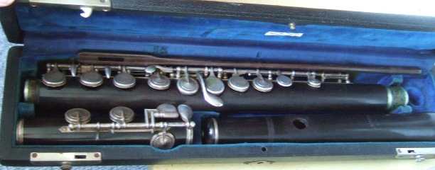 Appraisal: A hardwood flute inscribed 'F Buiison Paris' in a fitted