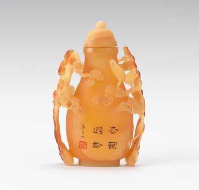 Appraisal: A Hornbill Snuff Bottle With High Relief Carving Expertly carved