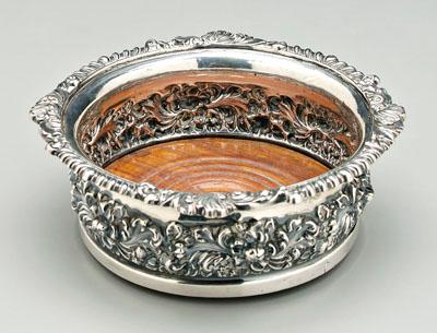 Appraisal: English silver wine coaster round with repouss floral border gadroon