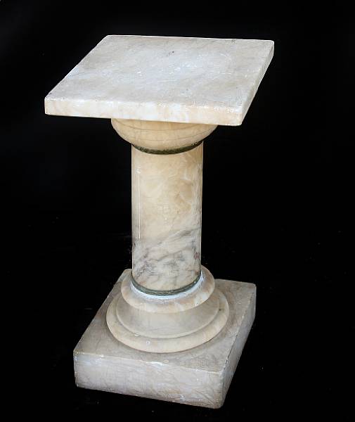 Appraisal: A carved alabaster pedestal height in width in depth in