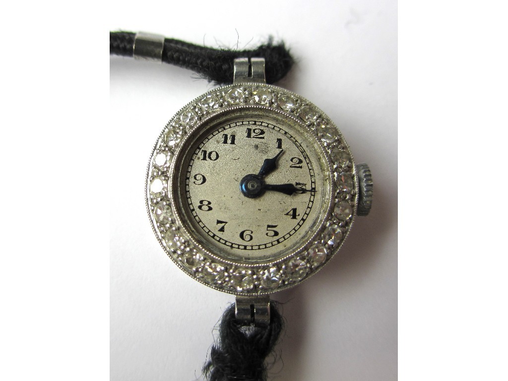 Appraisal: A ladies early th century platinum watch with diamond bezel