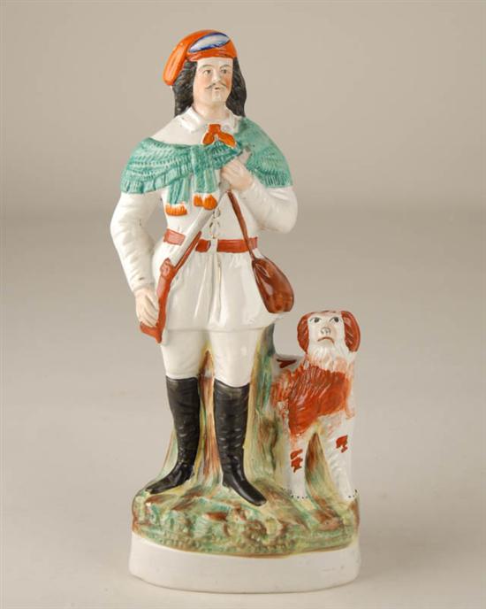 Appraisal: A Staffordshire Pottery Figure of a Scottish hunter with his