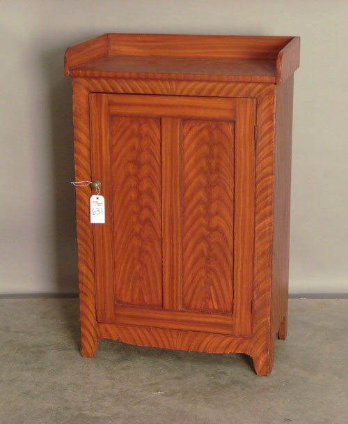 Appraisal: Jelly cupboard with one door and red faux grain Provenance