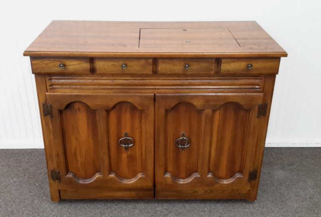 Appraisal: Vintage Oak Sewing Machine Cabinet Produced in the 's is