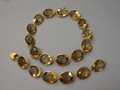 Appraisal: A SMOKY QUARTZ NECKLACE AND BRACELET SET the necklace having