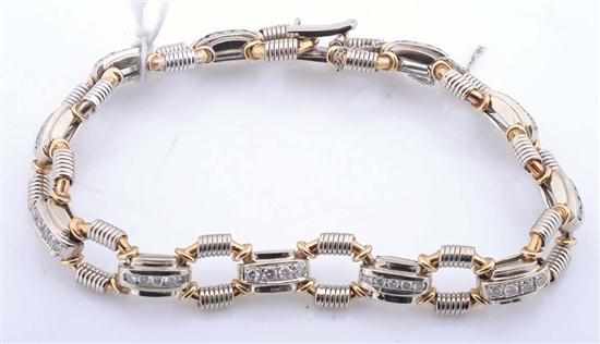 Appraisal: A DIAMOND BRACELET Comprising fancy open octagonal links with rectangular