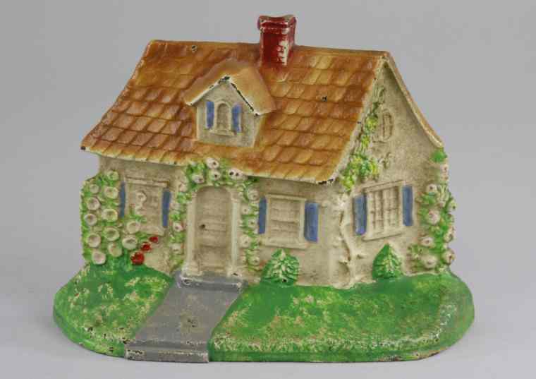 Appraisal: CAPE COD DOORSTOP Hubley depicts quaint white cottage w blue