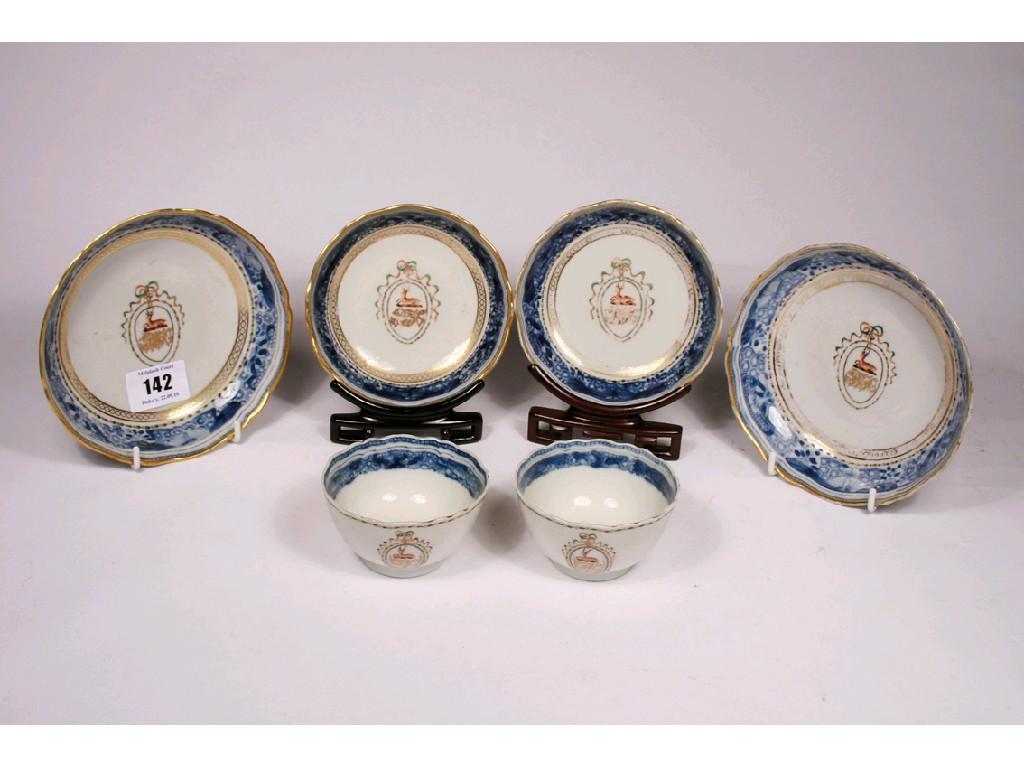 Appraisal: A PAIR OF CHINESE ARMORIAL TEA BOWLS AND SAUCERS enamelled