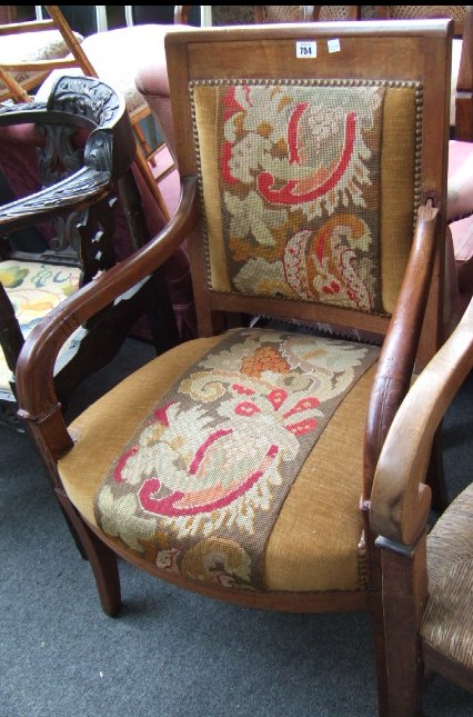 Appraisal: A Continental th century mahogany open armchair with carved arm