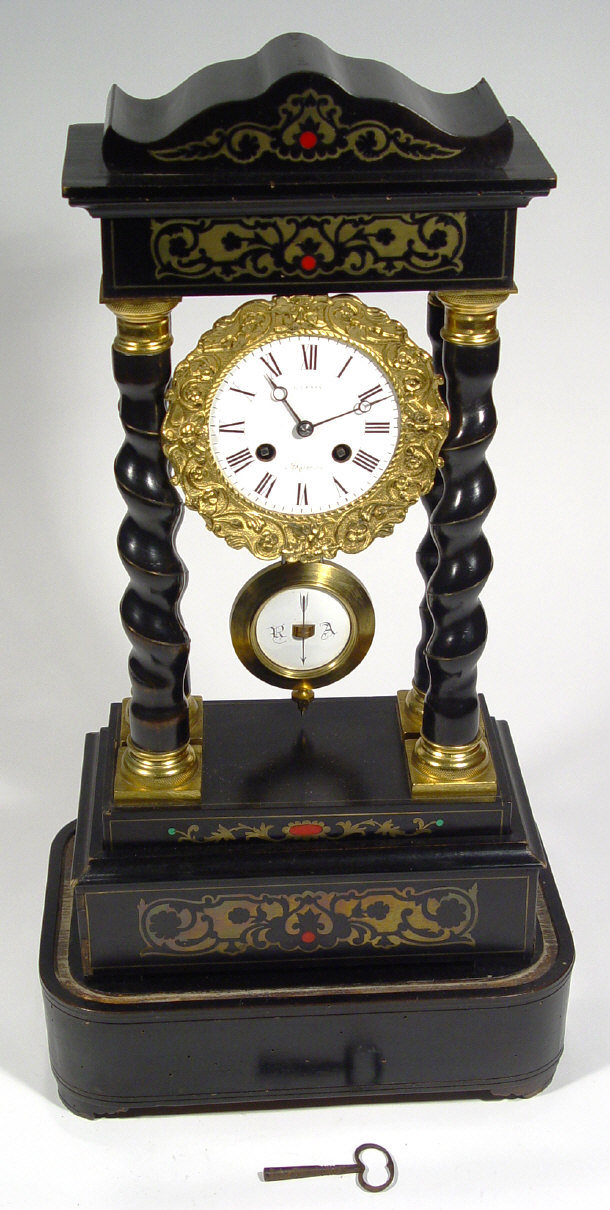 Appraisal: th Century ebonised portico eight day clock with brass inlay