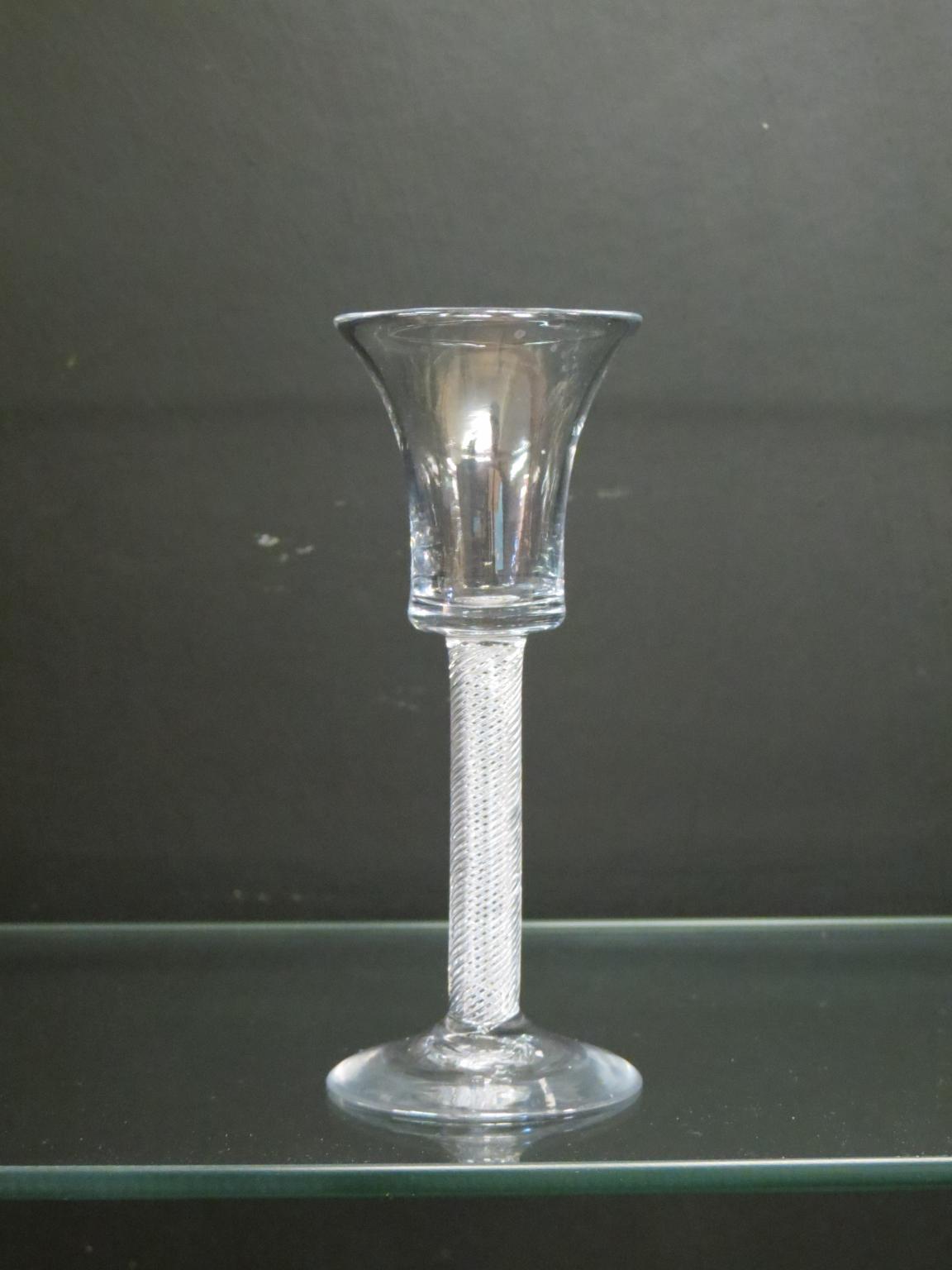 Appraisal: An th century English cordial glass waisted bell-bowl on air-twist