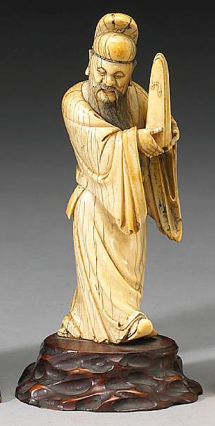 Appraisal: A tinted ivory figure of an immortal th Century Depicting