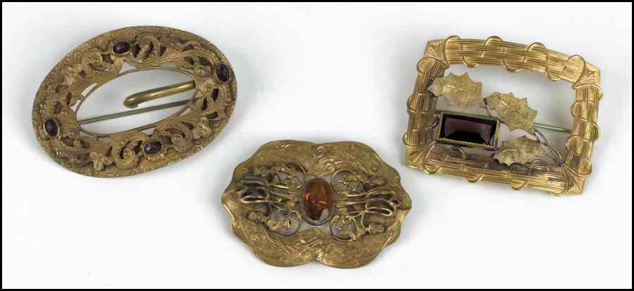 Appraisal: THREE VICTORIAN GOLD FILLED BROOCHES Condition No Specific Condition Recorded