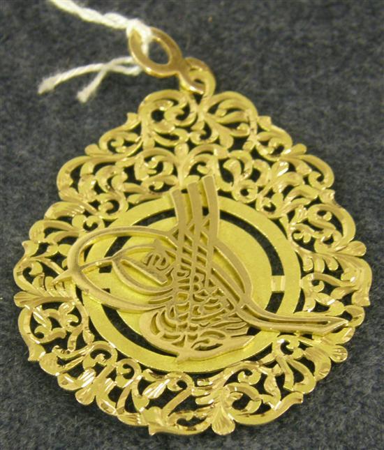 Appraisal: A NEAR EASTERN GOLD OPENWORK PENDANT