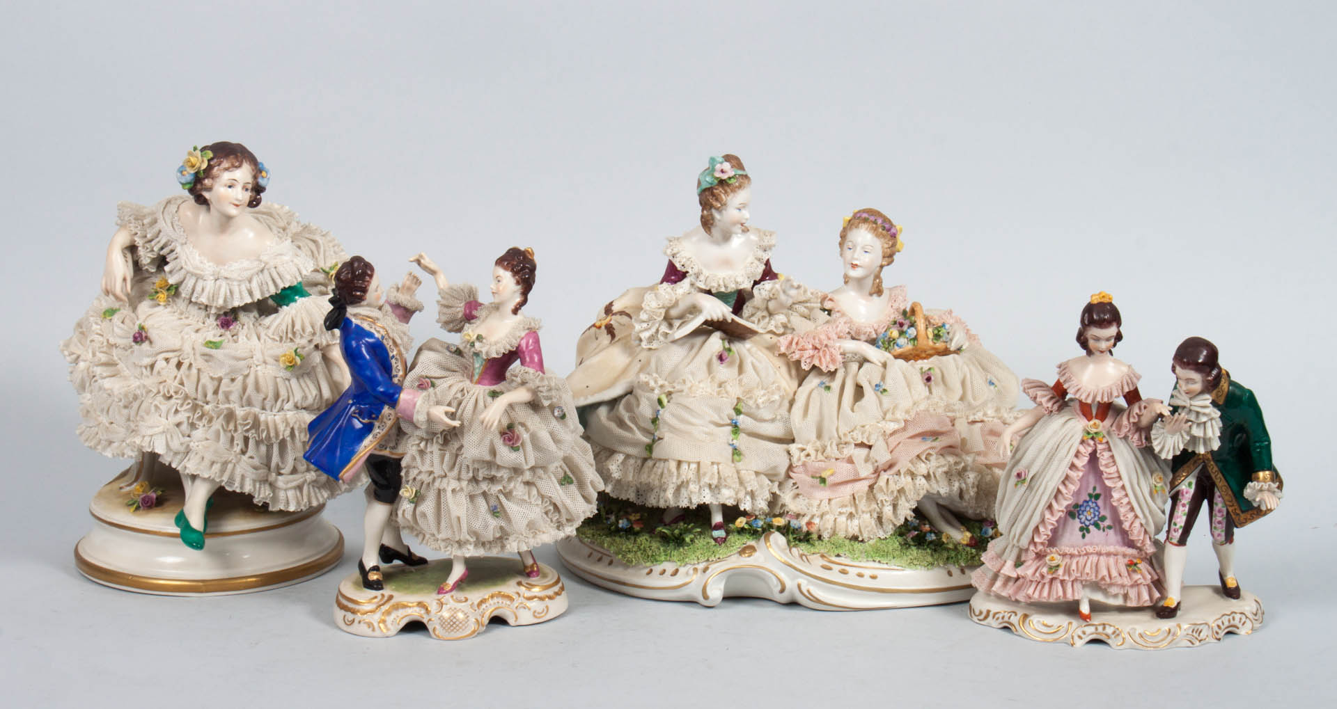 Appraisal: Four Dresden porcelain crinoline groups two women conversing two dancing