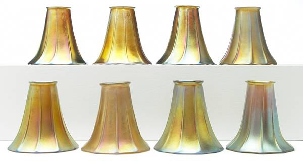 Appraisal: A set of eight Steuben Aurene ribbed glass floriform shades