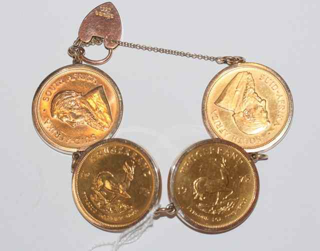 Appraisal: FOUR OZ GOLD KRUGER RANDS two and two mounted on