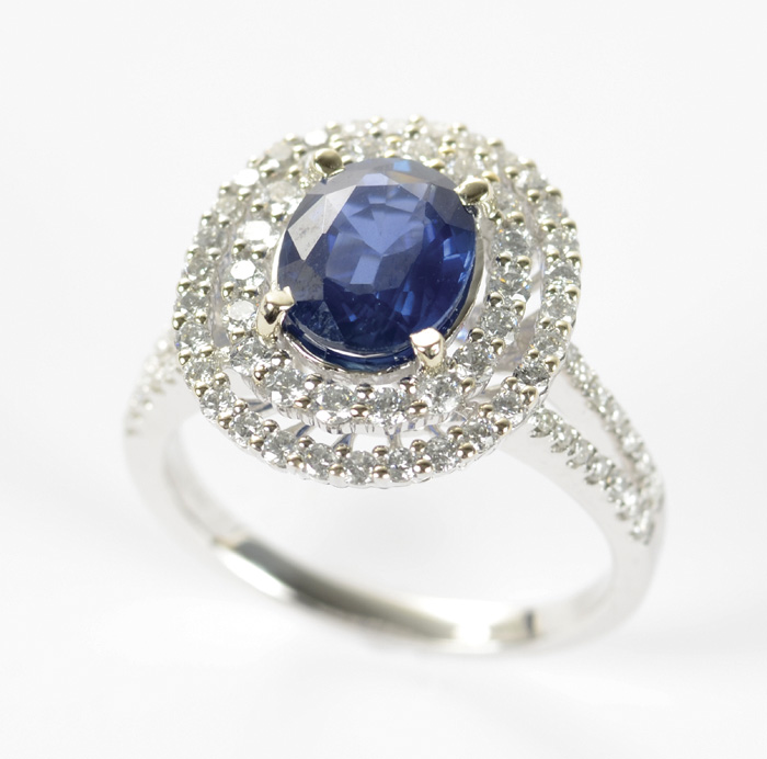 Appraisal: SAPPHIRE DIAMOND AND FOURTEEN KARAT WHITE GOLD RING with round-cut