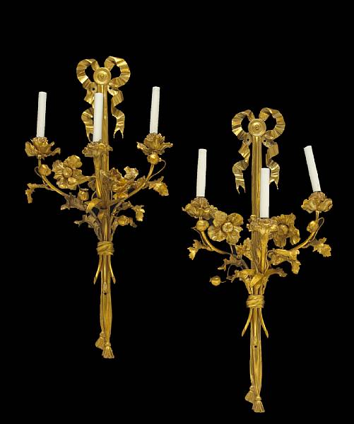 Appraisal: A pair of Louis XVI style gilt bronze three light