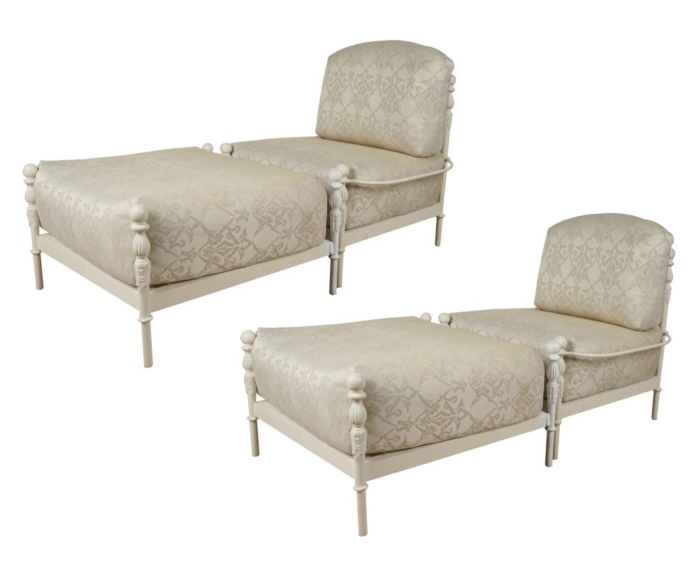 Appraisal: PAIR OF WHITE-PAINTED METAL CHAIRS OTTOMANScovered with off-white damask-style fabric