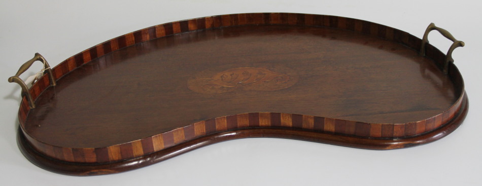 Appraisal: A Sheraton revival mahogany serving tray of kidney shape with