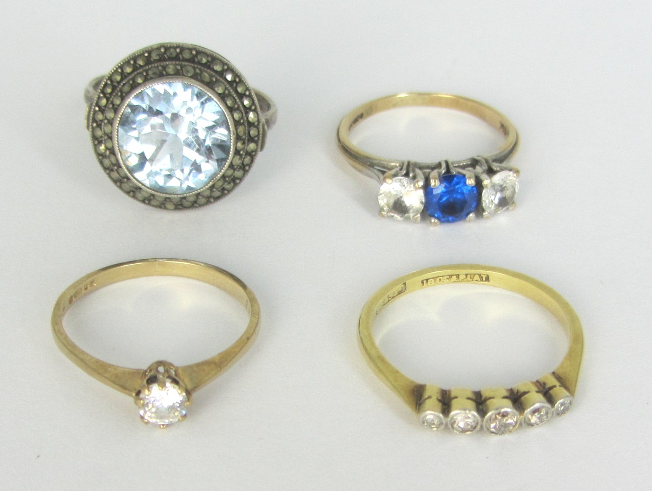 Appraisal: A gold and platinum diamond set five stone ring a