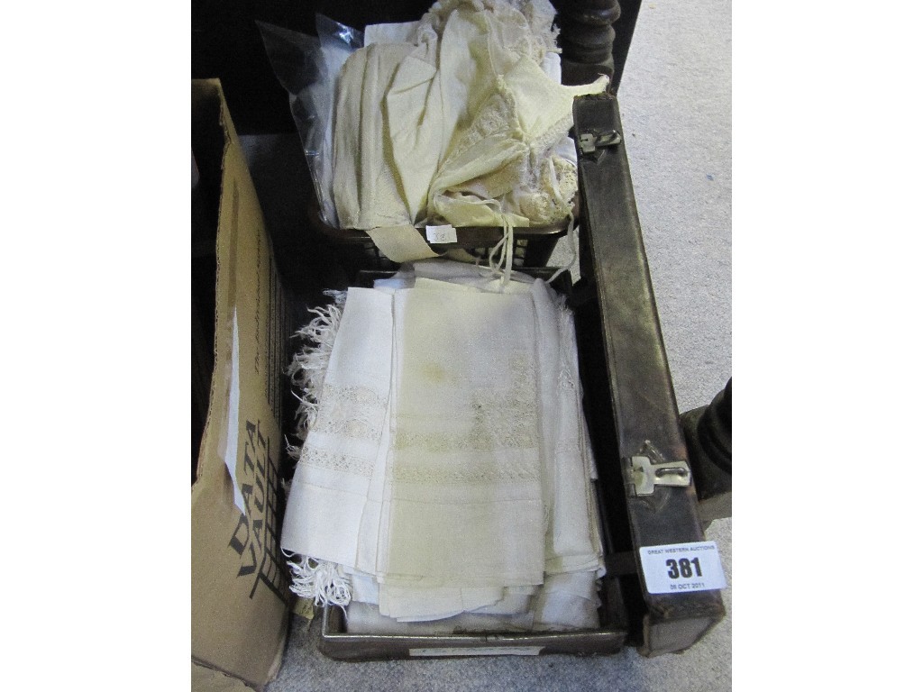 Appraisal: Lot comprising suitcase and a box of linen