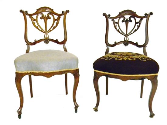 Appraisal: Pair of late th C Rococo Revival chairs elaborately carved