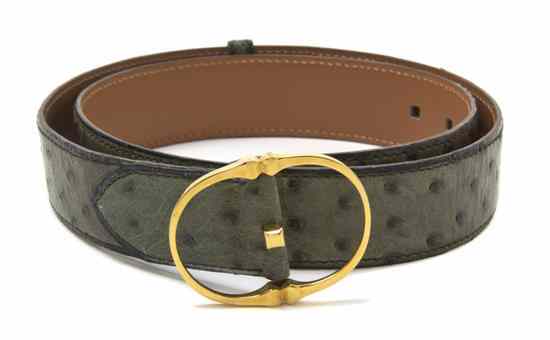 Appraisal: An Hermes 'Clou' Green Ostrich Belt with a gold buckle