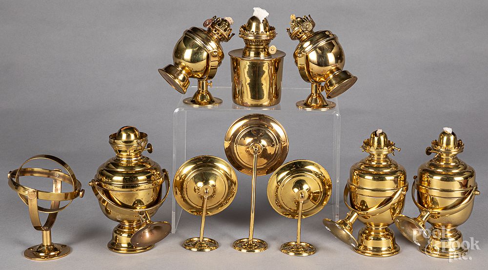 Appraisal: Six gimbaled brass fluid lamps Six gimbaled brass fluid lamps