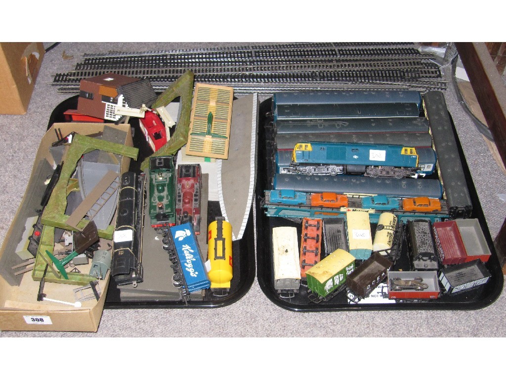 Appraisal: Lot comprising two trays of Hornby model train equipment buildings