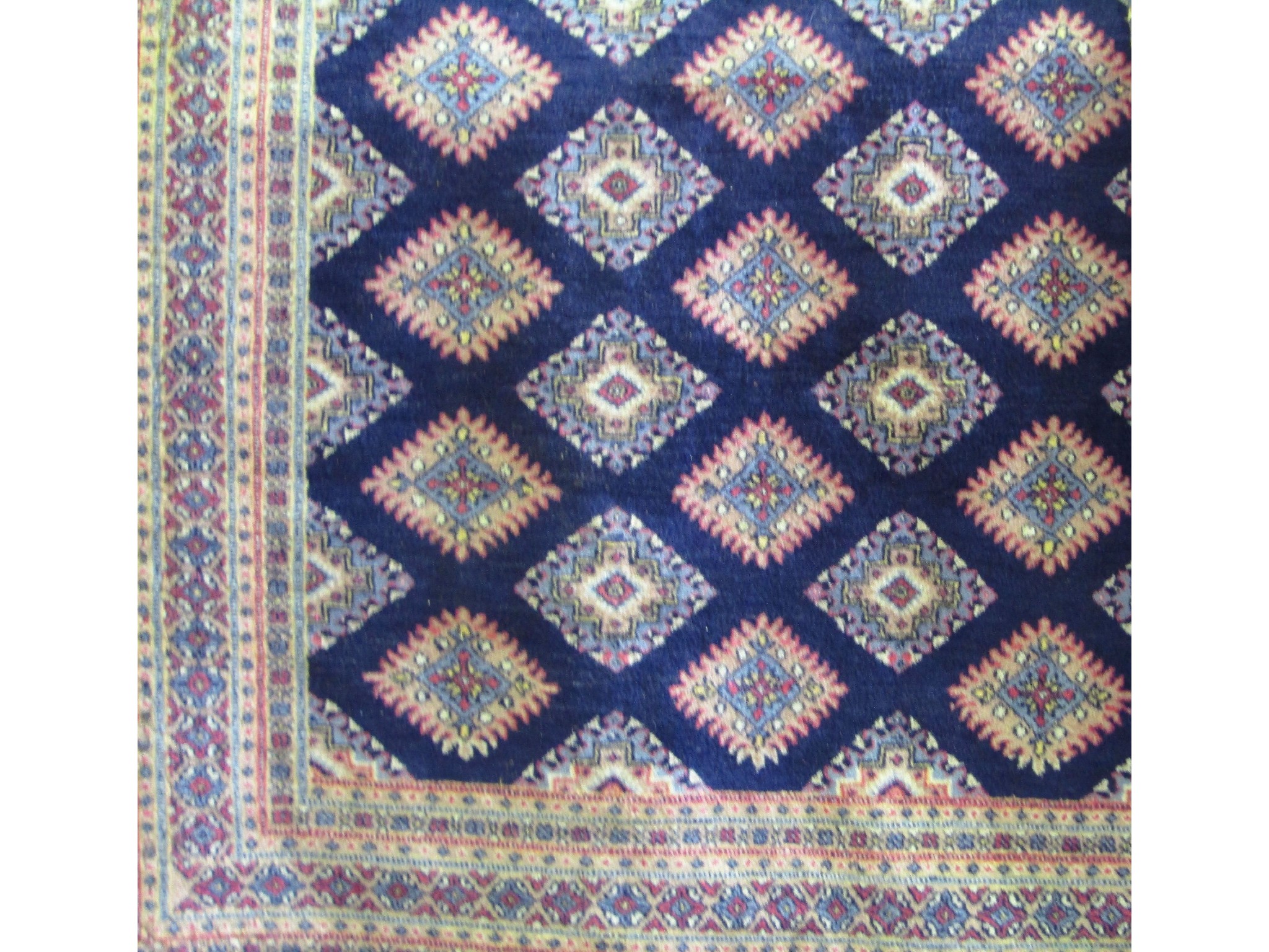 Appraisal: An eastern style wool work carpet with central blue ground