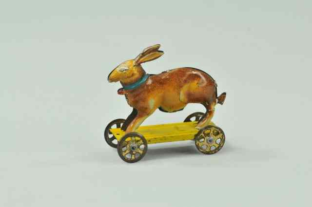 Appraisal: RABBIT ON WHEELS PENNY TOY Meier Germany lithographed tin depicts