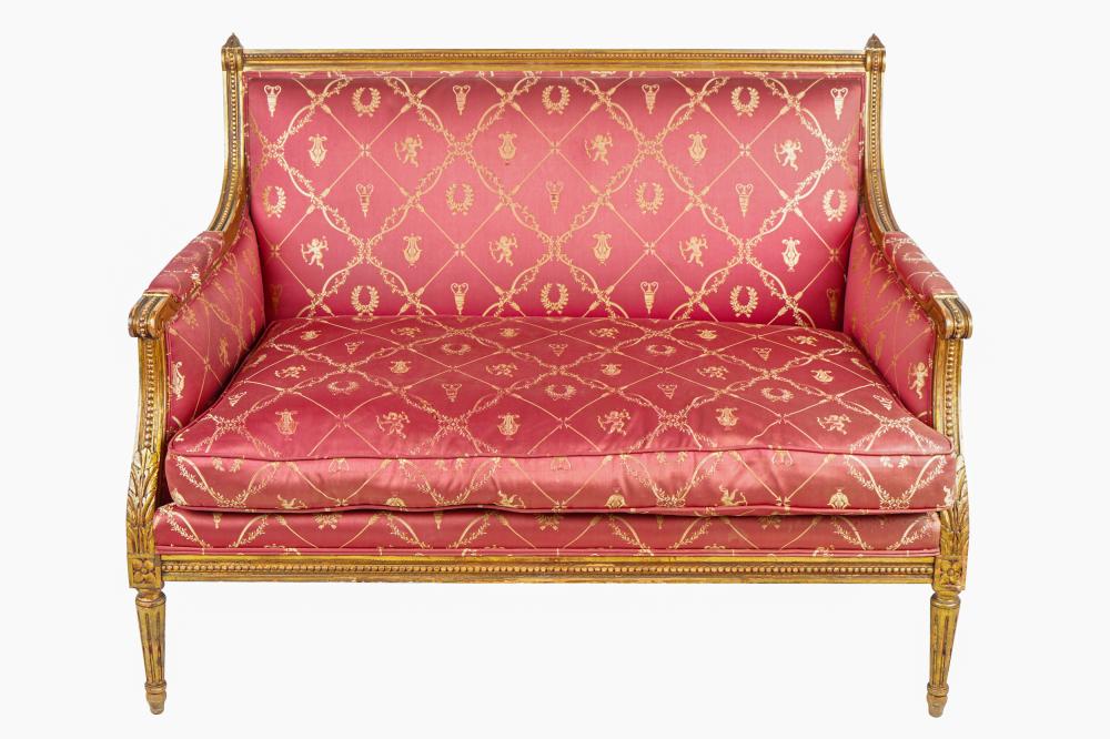 Appraisal: LOUIS XVI STYLE GILTWOOD SETTEEcovered in dark red and gold-colored