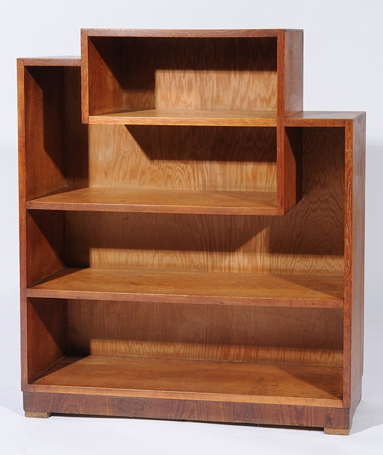 Appraisal: A HEALS OAK ASYMMETRIC BOOKCASE with four shelves on plinth